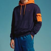 Young Man in Navy and Orange Hoodie